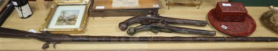 A Continental brass mounted flintlock pistol and another pistol and a rifle rifle 170cm